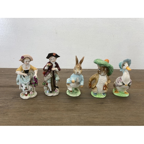 426 - A collection of items to include Schmeckenkecher Quartz mantel clock, six Beswick dog figurines, thr... 