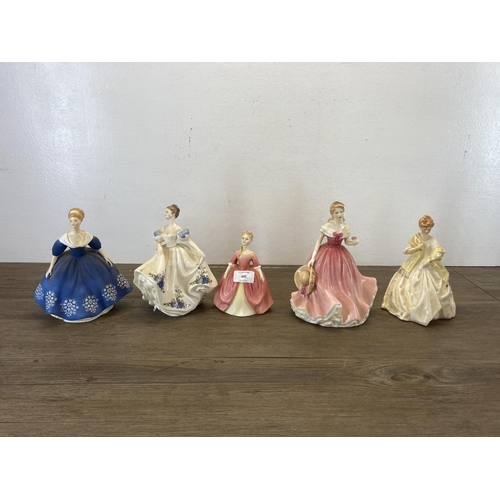 445 - Five ceramic figurines, four Royal Doulton and one Royal Worcester