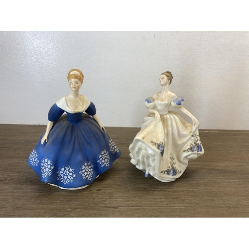 445 - Five ceramic figurines, four Royal Doulton and one Royal Worcester