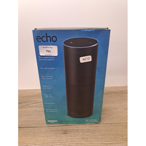 751 - A boxed Amazon Echo with power adapter and instruction manual