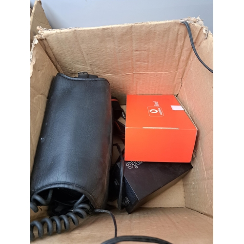 758 - Two boxes containing a large collection of telecom items to include cased Panasonic E-TACS car phone... 