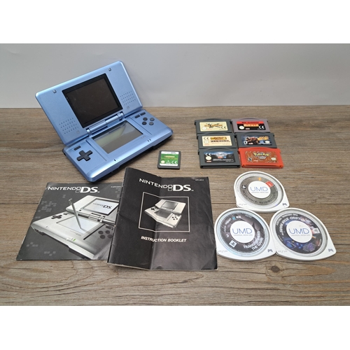 763 - A collection of handheld gaming items to include Nintendo DS console with instruction booklet, Profe... 