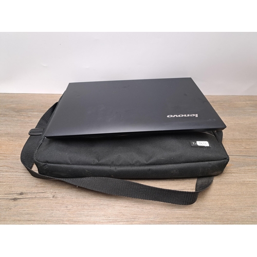 765 - A Lenovo B50-30 laptop with charger and carry bag