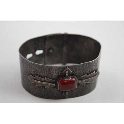 2110 - Two mid 20th century silver items, one gemstone set bangle and one pendant - approx. gross weight 71... 