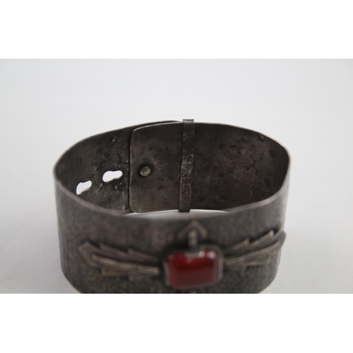 2110 - Two mid 20th century silver items, one gemstone set bangle and one pendant - approx. gross weight 71... 