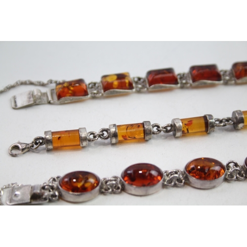 2137 - Three silver Baltic amber set bracelets - approx. gross weight 57g