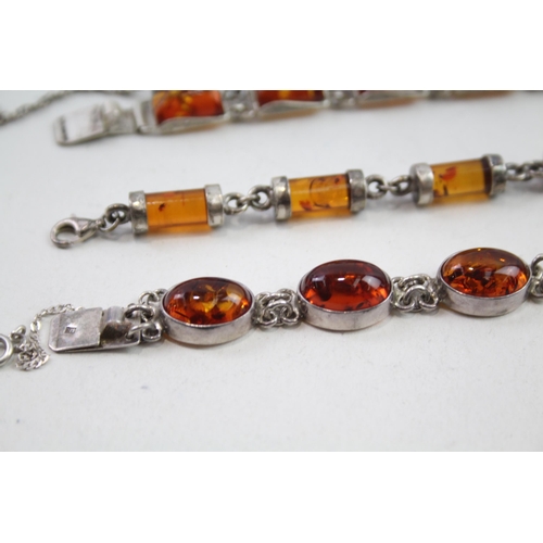 2137 - Three silver Baltic amber set bracelets - approx. gross weight 57g