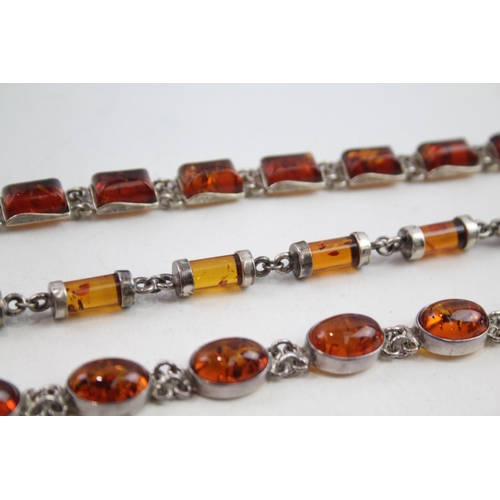 2137 - Three silver Baltic amber set bracelets - approx. gross weight 57g