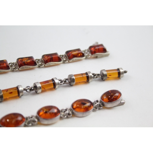 2137 - Three silver Baltic amber set bracelets - approx. gross weight 57g