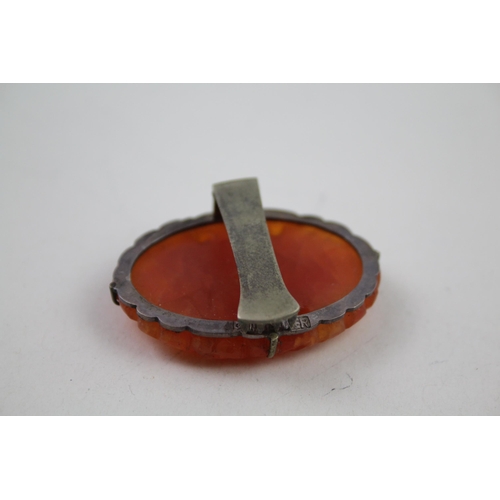 2146 - Two pieces of Chinese silver and white metal carved carnelian jewellery - approx. gross weight 37g