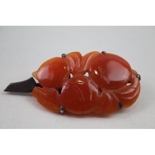 2146 - Two pieces of Chinese silver and white metal carved carnelian jewellery - approx. gross weight 37g