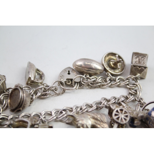 2147 - A vintage silver charm bracelet with assorted charms - approx. gross weight 57g