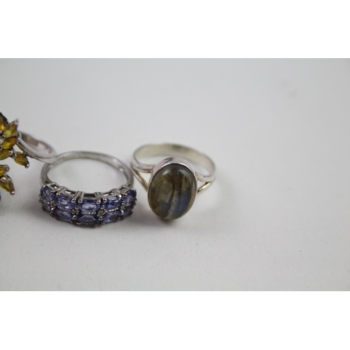 2151 - Eight silver gemstone set rings to include peridot, opal, tanzanite etc. - approx. gross weight 35g