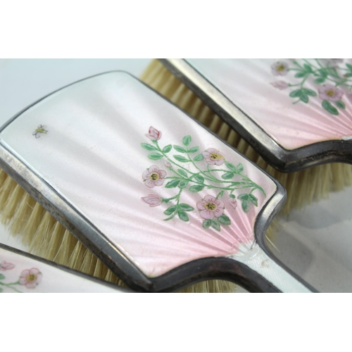 2196 - A hallmarked London sterling silver and guilloche enamel  three piece dressing table set, dated 1947... 