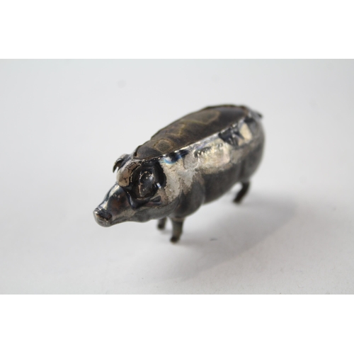 2202 - A hallmarked Birmingham sterling silver pig pin cushion - approx. gross weight 15g