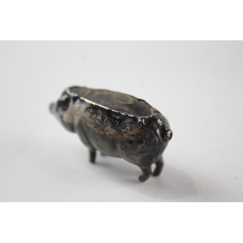 2202 - A hallmarked Birmingham sterling silver pig pin cushion - approx. gross weight 15g