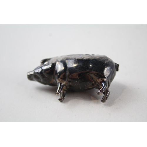 2202 - A hallmarked Birmingham sterling silver pig pin cushion - approx. gross weight 15g