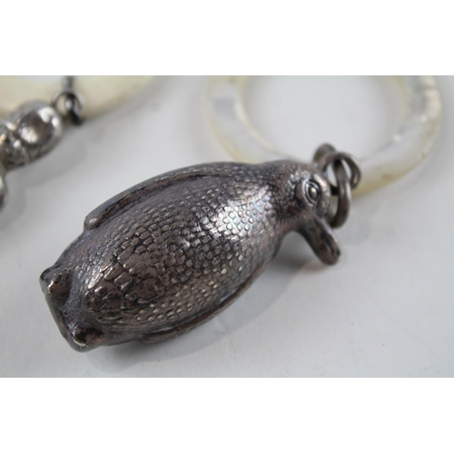 2208 - Two hallmarked .925 sterling silver baby rattles, one penguin hallmarked Birmingham 1939 and one gua... 