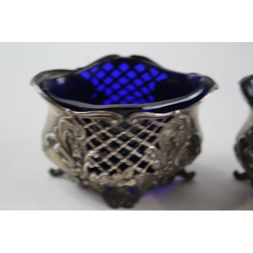 2212 - Two William Aitken hallmarked Birmingham sterling silver salt cellars with blue glass inserts - appr... 