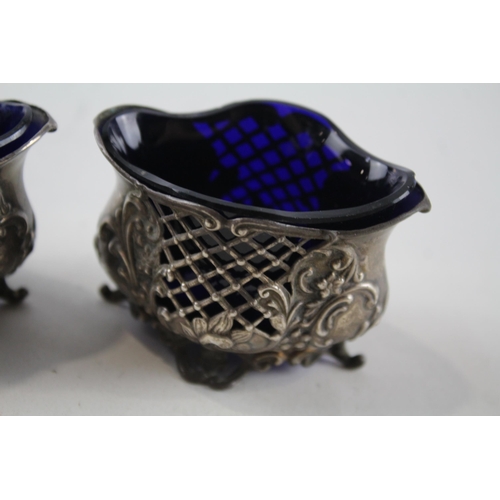 2212 - Two William Aitken hallmarked Birmingham sterling silver salt cellars with blue glass inserts - appr... 