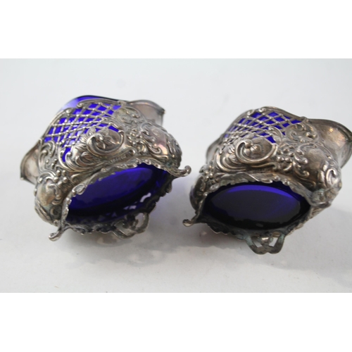 2212 - Two William Aitken hallmarked Birmingham sterling silver salt cellars with blue glass inserts - appr... 