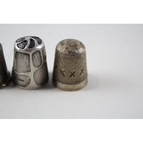 2230 - Four .925 sterling silver thimbles - approx. gross weight 32g