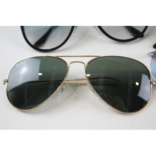 2314 - Four pairs of cased Ray-Ban sunglasses