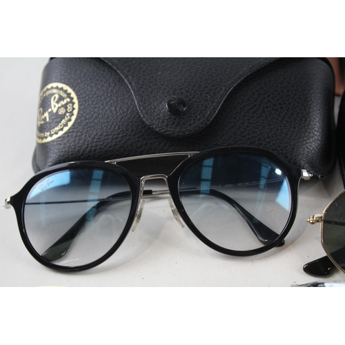 2314 - Four pairs of cased Ray-Ban sunglasses