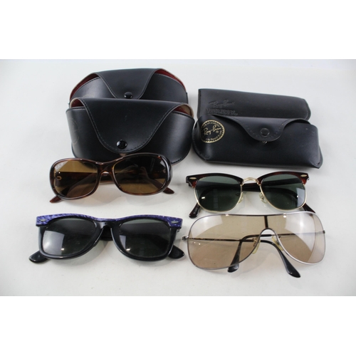 2318 - Four pairs of cased Ray-Ban sunglasses