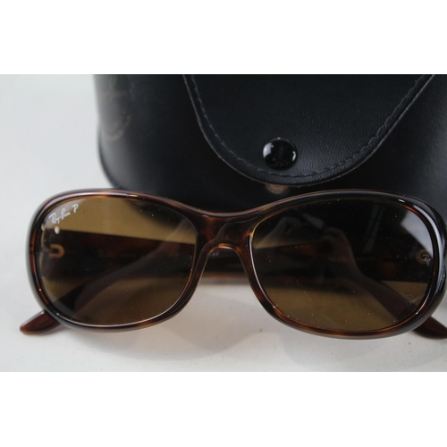 2318 - Four pairs of cased Ray-Ban sunglasses