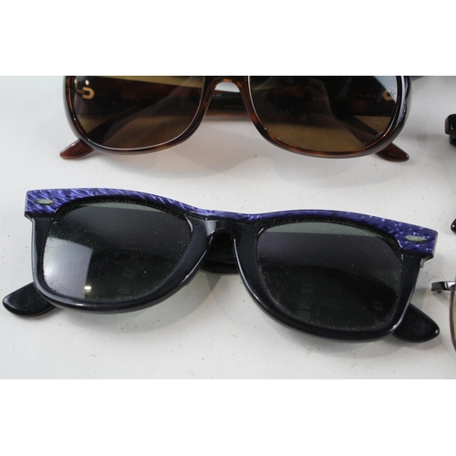 2318 - Four pairs of cased Ray-Ban sunglasses