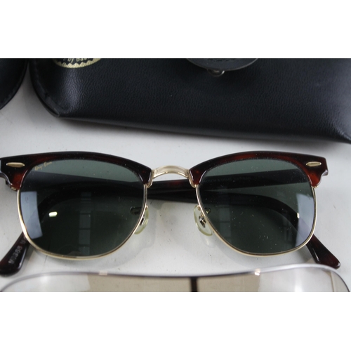 2318 - Four pairs of cased Ray-Ban sunglasses