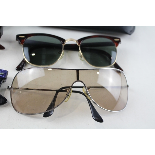 2318 - Four pairs of cased Ray-Ban sunglasses