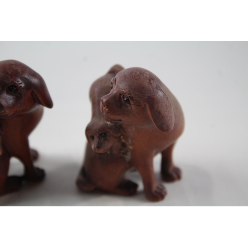 2337 - Two Oriental carved wooden netsuke figurines signed to base