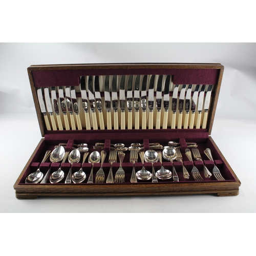 457 - A Viners 102 piece stainless steel and ivorine canteen of cutlery