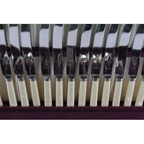 457 - A Viners 102 piece stainless steel and ivorine canteen of cutlery