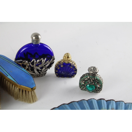 546 - A collection of ladies vanity items to include guilloche enamel dressing table set, perfume bottles ... 