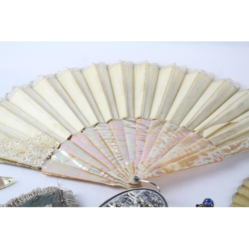 547 - A collection of vintage ladies vanity items to include mother of pearl fan, hairbrush, purse, haircl... 