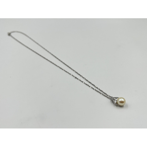 2002 - A stamped 14ct white gold faux pearl pendant necklace - approx. gross weight 2.7g