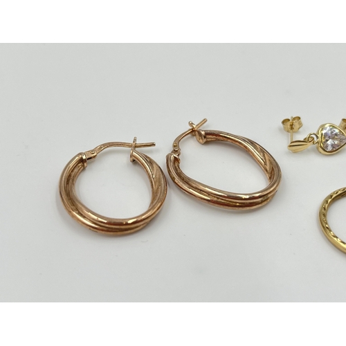 2004 - Three pairs of earrings, one .925 gilt silver, one 9ct gold CZ heart shaped and one yellow metal CZ ... 