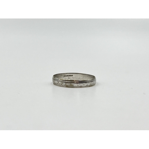 2008 - A hallmarked 9ct white gold wedding band, size N½ - approx. gross weight 1.08g