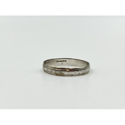 2008 - A hallmarked 9ct white gold wedding band, size N½ - approx. gross weight 1.08g