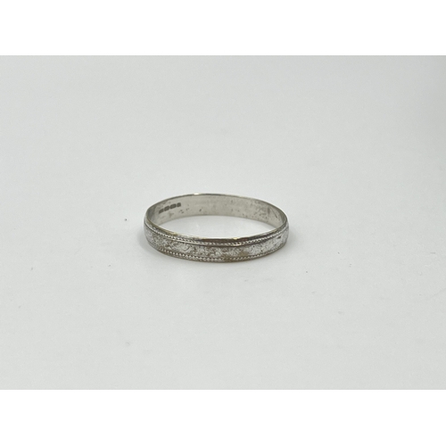 2008 - A hallmarked 9ct white gold wedding band, size N½ - approx. gross weight 1.08g