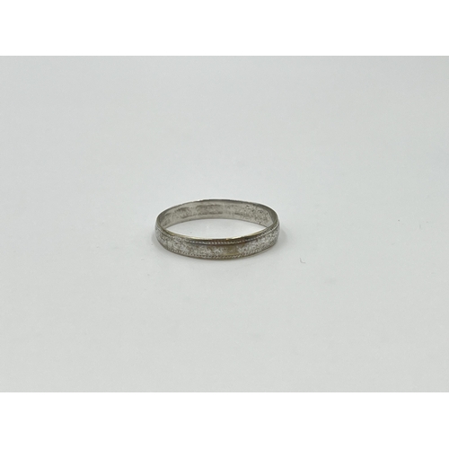 2008 - A hallmarked 9ct white gold wedding band, size N½ - approx. gross weight 1.08g