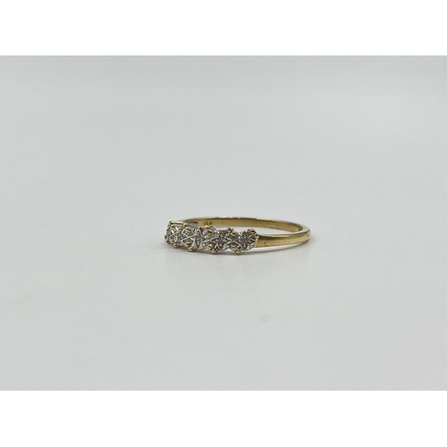 2013 - A hallmarked London 9ct gold diamond five stone ring, size M - approx. gross weight 1.15g