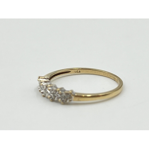 2013 - A hallmarked London 9ct gold diamond five stone ring, size M - approx. gross weight 1.15g