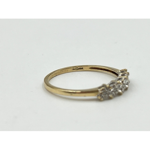 2013 - A hallmarked London 9ct gold diamond five stone ring, size M - approx. gross weight 1.15g