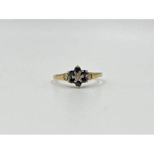 2016 - A hallmarked Birmingham 9ct gold sapphire and diamond floral cluster ring with diamond set shoulders... 