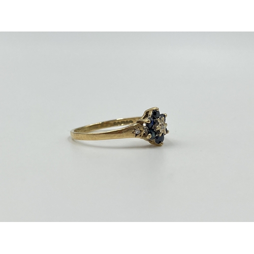 2016 - A hallmarked Birmingham 9ct gold sapphire and diamond floral cluster ring with diamond set shoulders... 