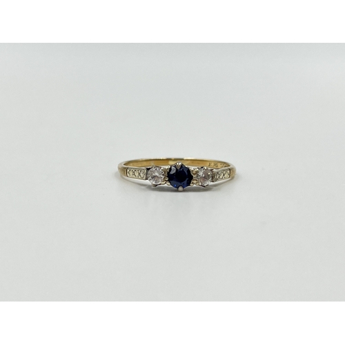 2019 - A 9ct gold sapphire and clear gemstone ring, size P - approx. gross weight 1.58g